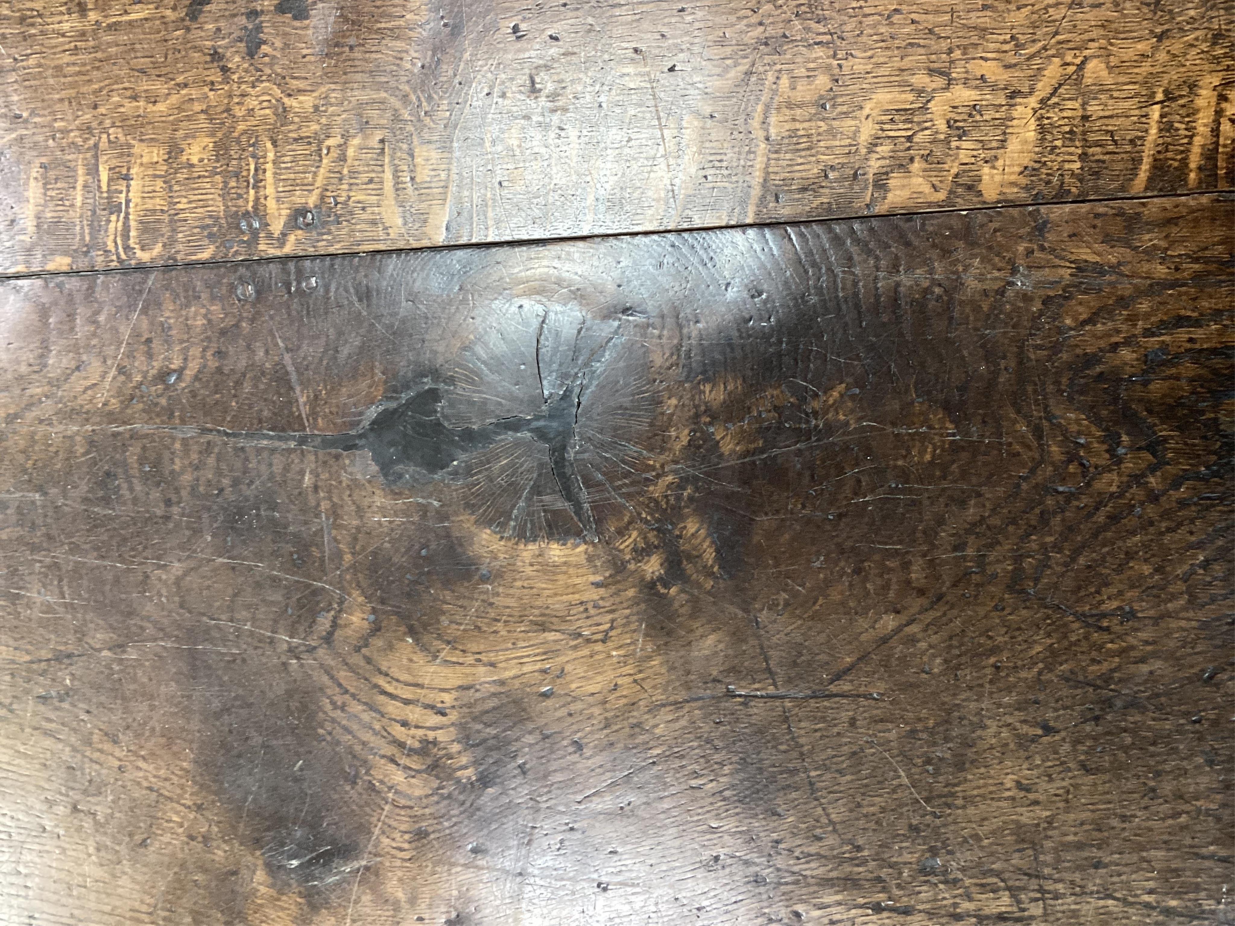 An 18th century style rectangular oak refectory dining table, width 243cm, depth 90cm, height 72cm. Condition - fair